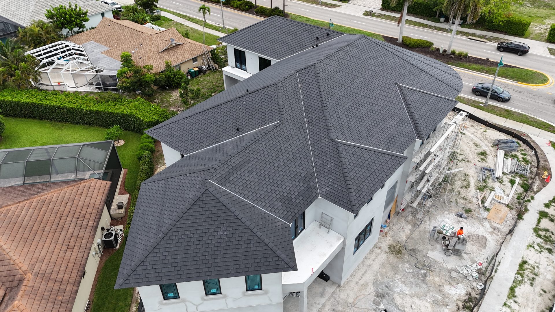 Aerial view of a completed shingle roof installed by Anchor Construction Group in Southwest Florida